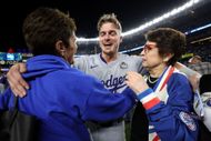 Enrique Hernández with Ilana Kloss and Billie Jean King after a Dodgers win in 2024. (Image via Getty)